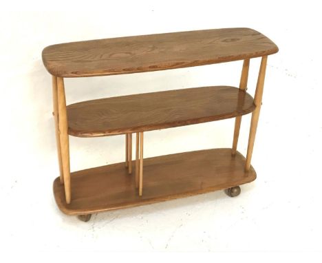 ERCOL SET OF LIGHT OAK OPEN SHELVESthe moulded top supported by tapering turned supports with two shelves below, on castors, 