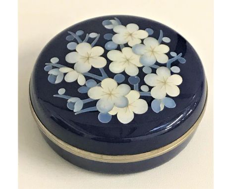 JAPANESE ANDO CLOISONNE CIRCULAR TRINKET BOXwith a dark blue ground, the lid decorated with flowers, the interior lined in bu