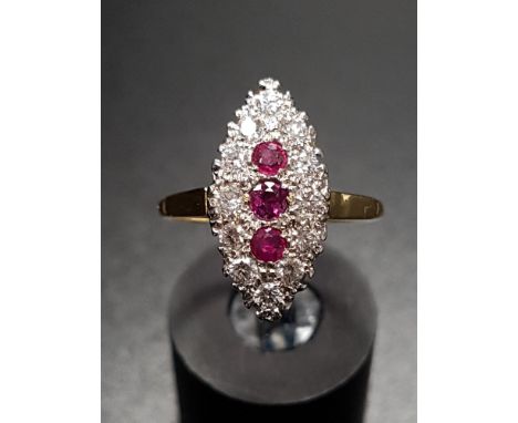 ART DECO STYLE RUBY AND DIAMOND PLAQUE RINGthe three vertically set rubies in twelve diamond surround totalling approximately