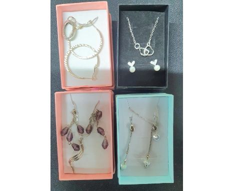 Four 925 silver chains with stone pendants, all with associated earrings, all in presentation boxes (4) 
