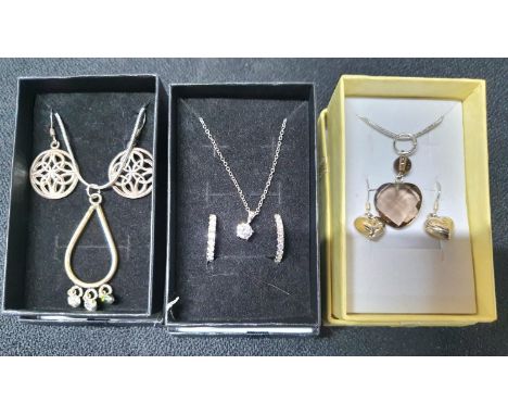 Three 925 silver chains and pendants, all with associated earrings, all in presentation boxes (3) 