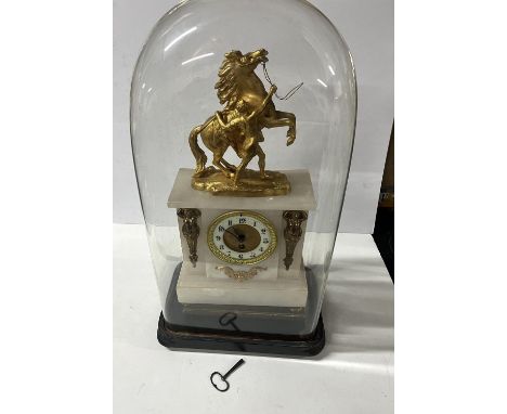Ornate French gilt mantle clock housed in huge glass dome with key 