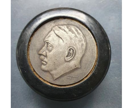 2-part ebonised wood snuff box with a circular metal disk on one end depicting Adolf Hitler in profile the other size a Germa
