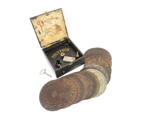 Early 20th century German Polyphon in black case with moulded decoration of putti, playing 16.5cm diameter discs, No. 36641, 