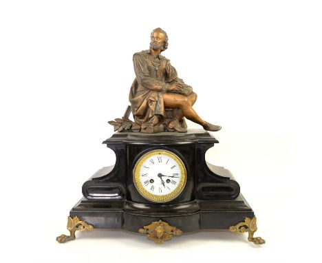 Late 19th century French black slate and gilt metal mounted eight day mantel clock, with spelter figure to top of a man sitti