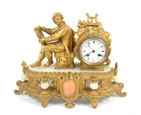 French gilt metal alabaster mantel clock with a figure holding a book, white enamel dial, Roman numerals on stepped plinth ba