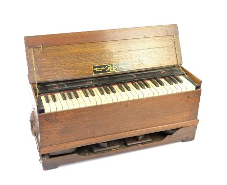 Oak cased portable harmonium, with label to interior 'UNEX Sunday School Union, 56 Ludgate Hill, London, EC', H80 x W73.5 x D