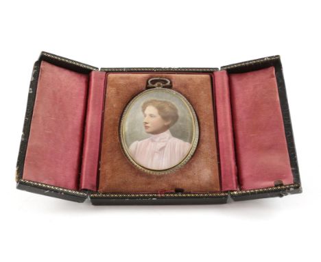 Early 20th century portrait miniature of a lady in a high-collared blouse with her hair up, in oval brass mount and fitted ca