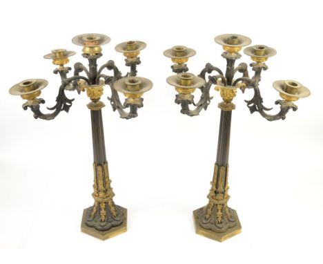 Pair of 19th century cast metal five light candelabra the reeded columns on hexagonal weighted bases, 62cm