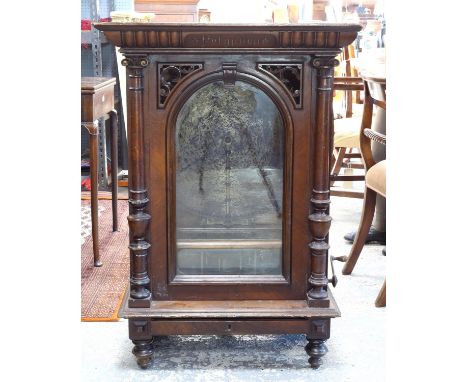 Late 19th century walnut cased free standing and coin operated Polyphon by Nicole Freres of Leipzig, the case of architectura