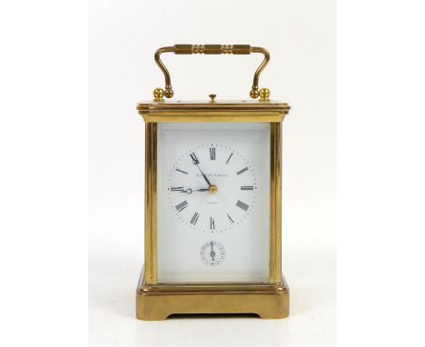 Brass repeating carriage clock by Matthew Norman, with white enamel dial with Roman numerals and subsidiary dial, eleven jewe