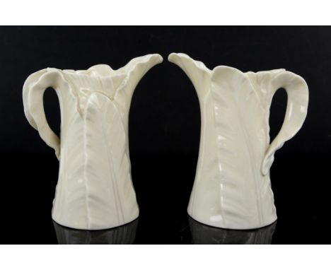 Two Royal Worcester leaf jugs, circa 1920s, green printed marks to base, h15cm