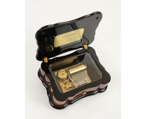 Reuge 'Samba' Contemporary Music Box, walnut case with floral marquetry and ebonised scalloped edges on brass bun feet, 1 cyl