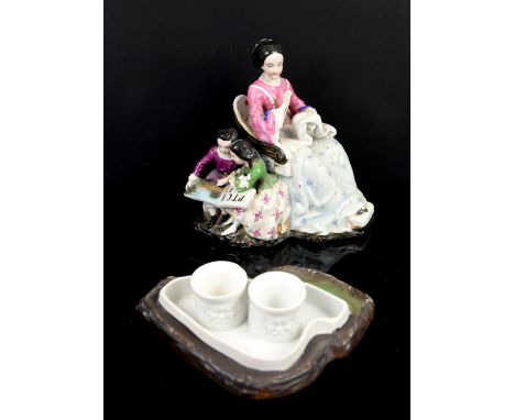 Porcelain figural inkwell, the cover in the form of Victorian woman embroidering with two children reading at her side,  whit