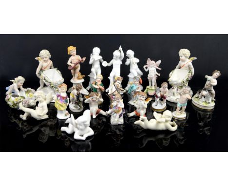 Continental porcelain figure of a cupid sat on a goat holding grapes, h7.5cm, two others with goats, a cupid playing violin, 