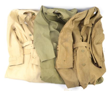 Four Military  Mackintoshes -WW2 and later comprising a brown mac purported to have belonged to Ronald James Peters of Grimsb