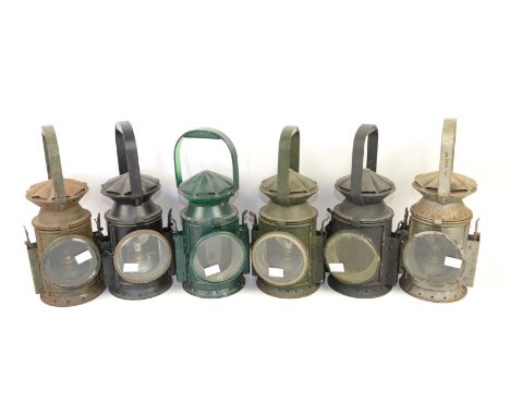 WWII military green painted railway lamp, with applied label stamped Wakefields, Birmingham 1945,another in black, two others