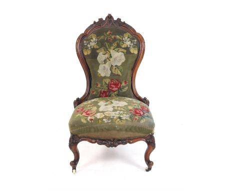 Victorian rosewood framed chair with carved back on carved cabriole legs and casters with tapestry seat 