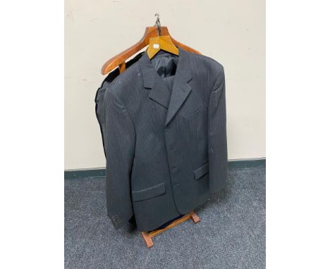 A gent's valet stand together with assorted gent's suits 