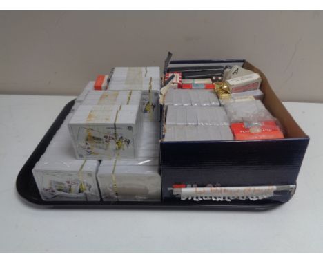 A tray containing a large quantity of playing cards and casino dice (many sealed).  