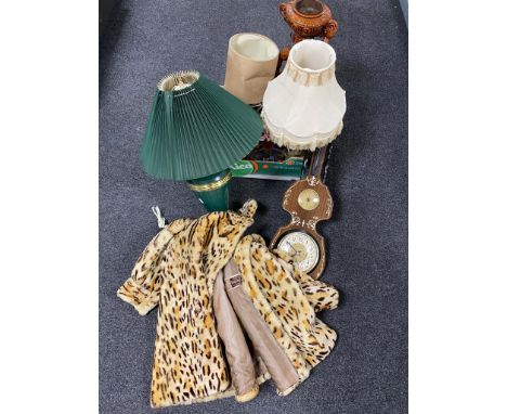 A box containing assorted table lamps, glass shades, contemporary barometer, a cheetah print coat.    