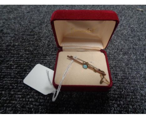 A 9ct gold bar brooch set with an opal, weight 2.2g.   CONDITION REPORT: Pin is white metal. 