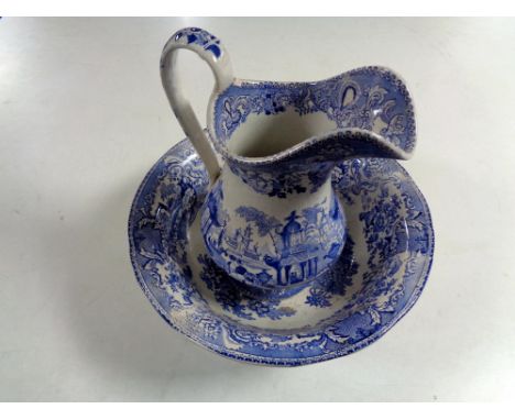 An antique blue and white wash jug with basin.  
