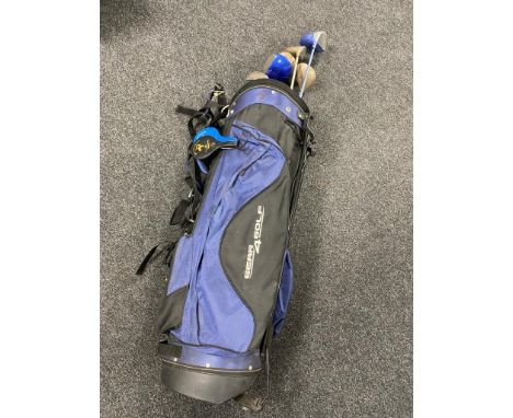 A golf bag containing five assorted drivers to include Triumph and Dunlop, three irons and two putters 