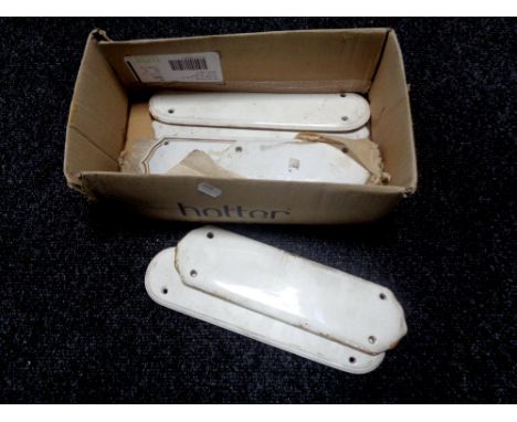 A box containing early 20th century ceramic finger plates. 