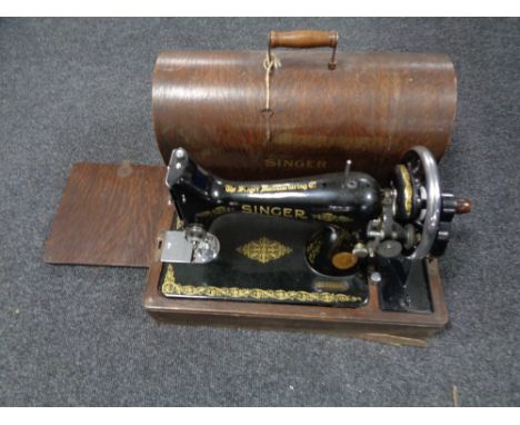 A vintage Singer cased sewing machine.  