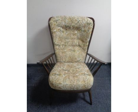 An Ercol elm and beech armchair