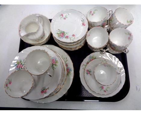 A tray containing 40 pieces of antique Worcester rose patterned tea china.  