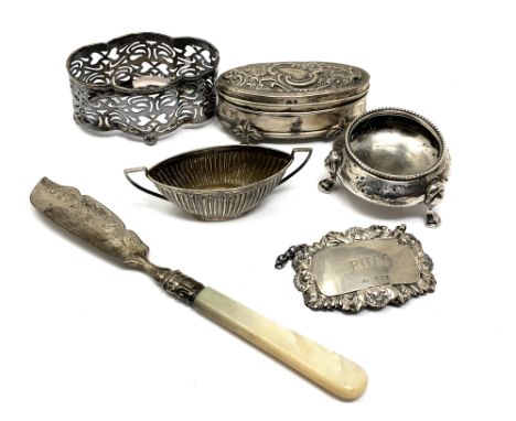 A collection of silver items including Rum label, small casket etc 