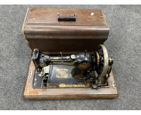 A vintage Jones cased sewing machine.  