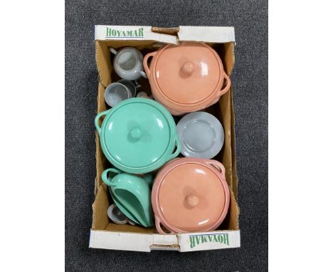 A box containing a Perrings harlequin tea and dinner service.  