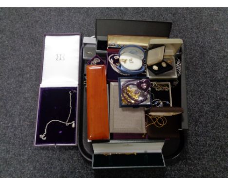 A tray containing a quantity of boxed costume jewellery to include a Mappin and Webb of London pendant on chain, together wit