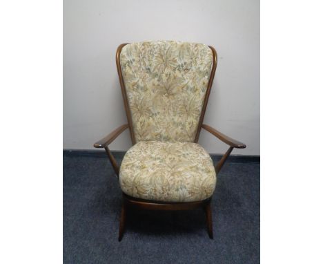 An Ercol elm and beech armchair