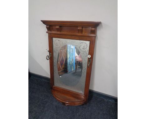 An Edwardian frosted glass framed hall mirror with shelf and coat hooks 