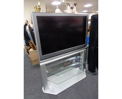 A Toshiba 37'' LCD TV with remote, on stand.  