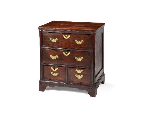 A George II oak chest of drawersWith an unusual configuration of two long drawers above two short drawers, standing on bracke