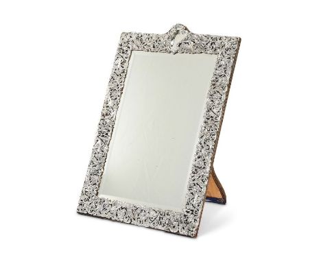 A large late Victorian silver framed dressing table mirror by William Comyns, London, 1897Pierced and chased with birds, flow
