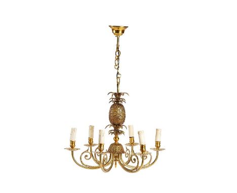 A gilt brass five light pineapple cast chandelier
The fruit stem with scrolling branches and stellar cast drip pans, fitted f