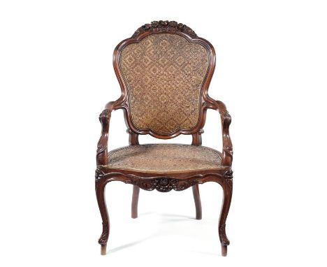 A mid 19th century Chinese export padouk armchair in the Louis XV styleThe shaped rattan back within a moulded frame and surm