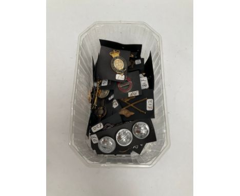 A collection of British insignia including Women's Land Army badges, ARP badge, shoulder titles etc 