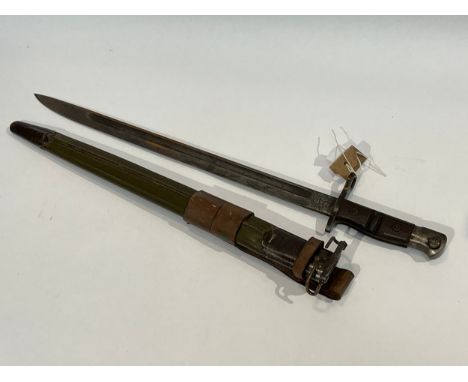 A WWI US 1917 Remington bayonet with steel mounted leather scabbard 