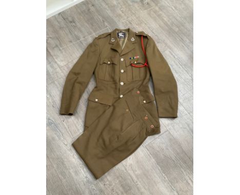 A 1946 dated British Army Officer's Service Dress jacket and trousers, the jacket by Burberry's, Royal Military Police insign