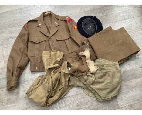 A quantity of 1950's British Army uniform including Battledress blouse with Royal Military Police insignia, Battledress trous