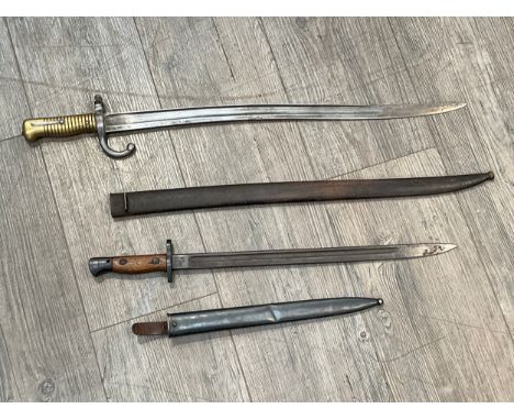 A 19th Century French Model 1866 Chassepot sabre bayonet, dated 1871 to blade back, with scabbard. A 1907 pattern bayonet by 