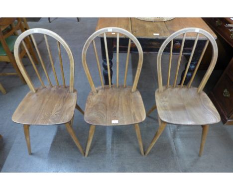 A set of three Ercol Blonde elm and beech Windsor chairs 