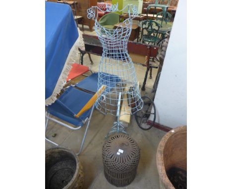 A steel dressmaker's mannequin and a steel bird cage 